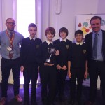 Winning students with their business trophy