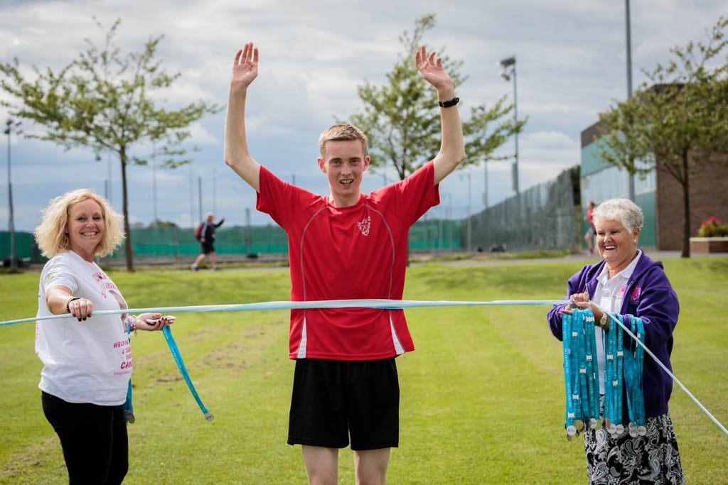 Student at the finishing line of a race