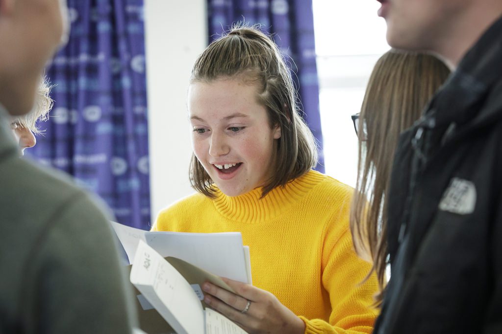 Student opening herexam results and looking suprised