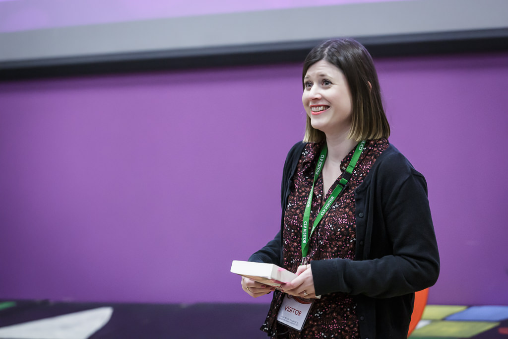 Author Kate Weston holding her book